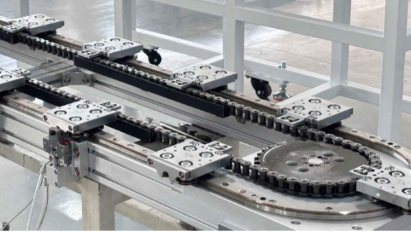 自動化組裝生產(chǎn)線中環(huán)線平臺，為什么更推薦定距鏈條傳動機構(gòu)？